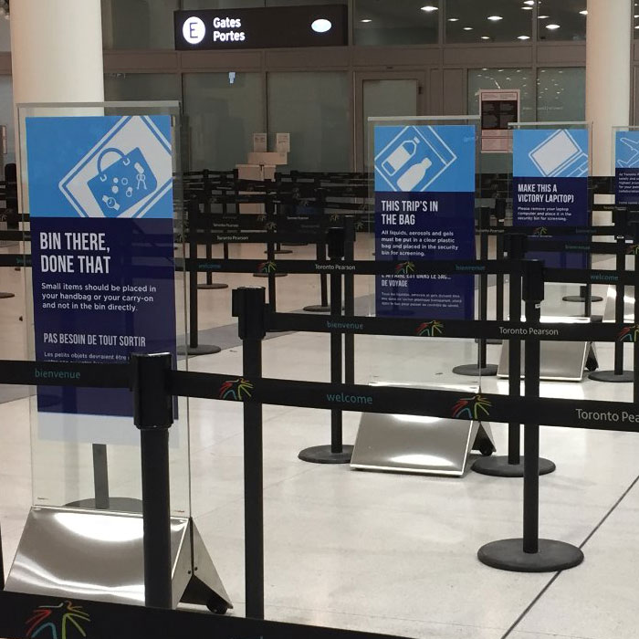 Image of instructional posters setup at Pearson airport